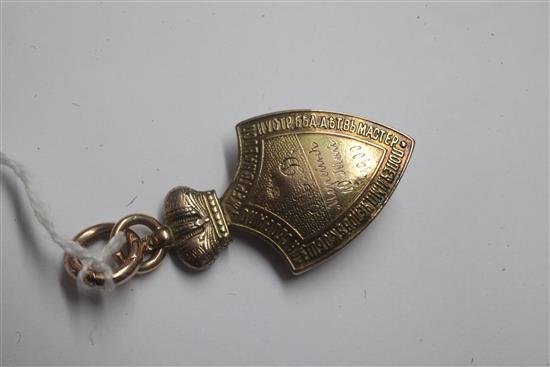 An early 20th century Russian 56 zolotnik gold shield shaped pendant, 4cm.